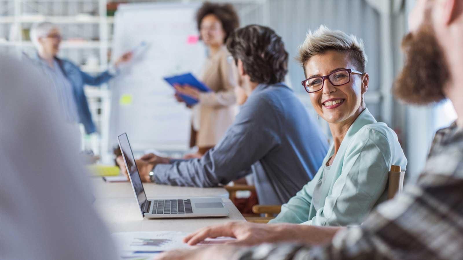 Group of colleagues working together in a meeting room