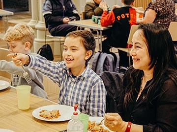 Woman and children at Good Grub Club