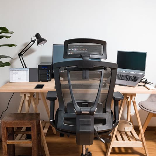 An ergonomic chair and home desk set up