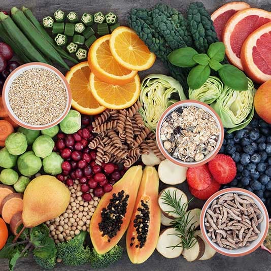 A selection of high fibre fruit, vegetables and grains
